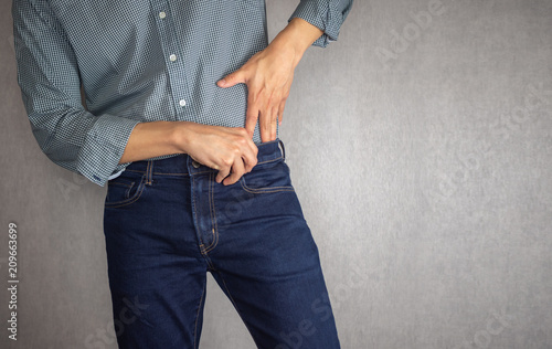 Tuck shirt into jeans close up