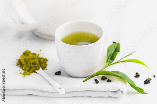 Green tea In white cup White background aroma 