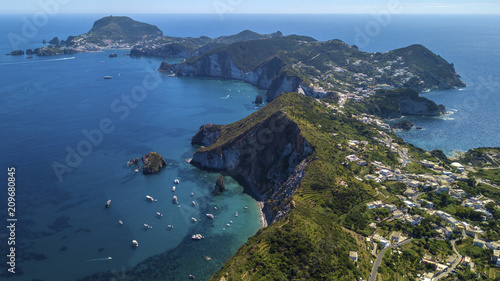 Aerial view of Ponza, island of the Italian Pontine Islands archipelago in the Tyrrhenian Sea, Italy. On the island there are few houses between the Mediterranean vegetation and the sea.