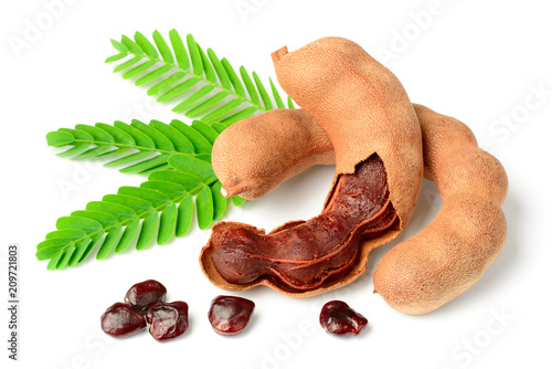 fresh tamarind fruits and leaves isolated on white background