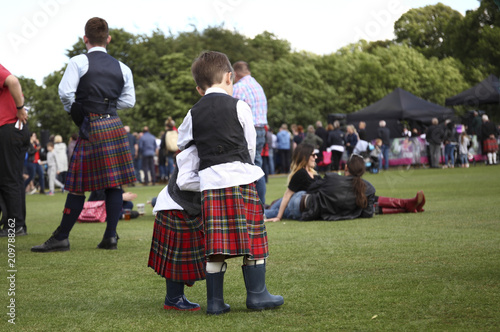 Two boys in kilts at the festival