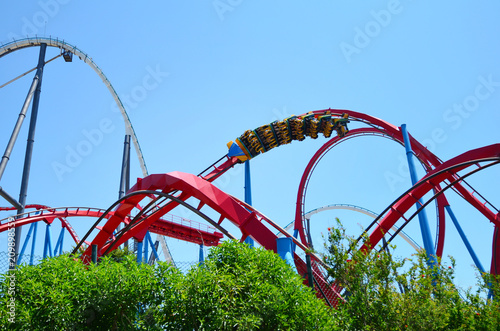 Big Roller Coaster in Amusement Park in a Sunny Day