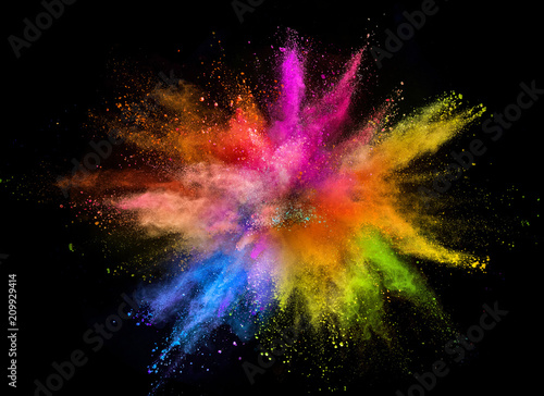 Colored powder explosion isolated on black background.