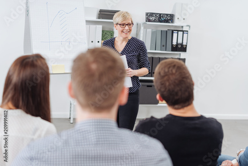 Businesswoman giving a presentation to colleagues