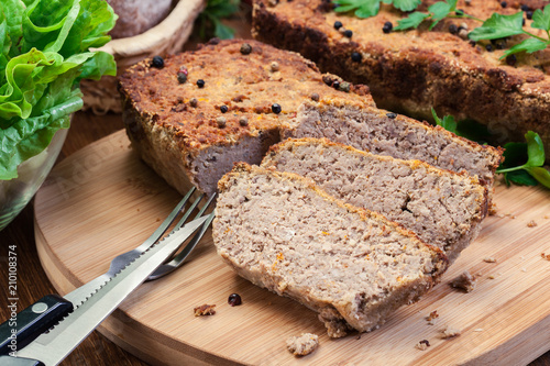 Traditional delicious meat pate with chicken liver on cutting board