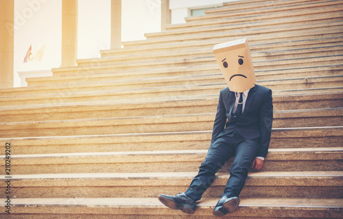 Businessman masked stress on the company stairs.