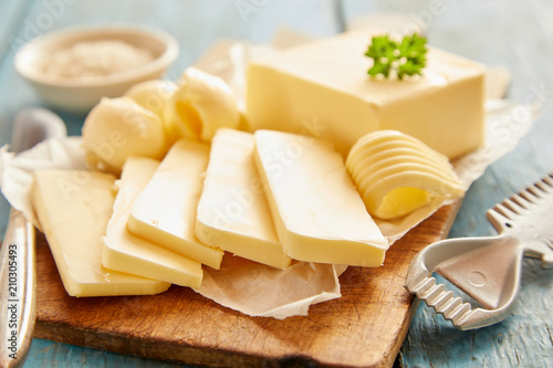 Close up view of butter sliced on cutting board