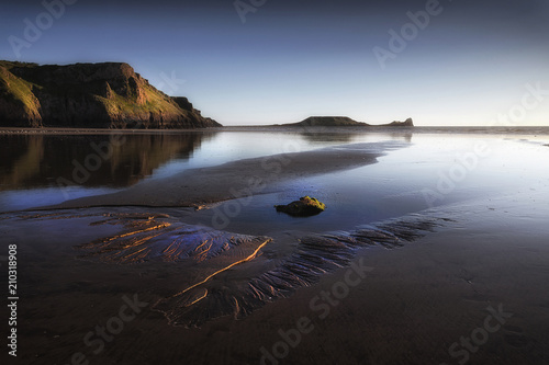 Blue hour at Worms Head on the Gower peninsula in Swansea, South Wales, UK 