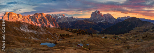 Selva di Val Gardena, Scenic mountain landscape, Italian Dolomites with dramatic sunset and cloudy sky at background.