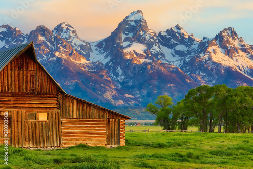 This abandoned, vintage barn in Mormon Row has the Grand Tetons in the background. Located in Jackson Hole, Wyoming, it is listed on the National Register of Historic Places.