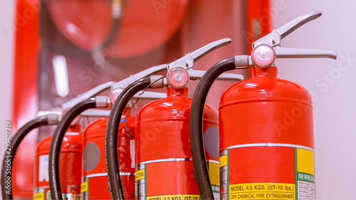 Red tank of fire extinguisher Overview of a powerful industrial fire extinguishing system.