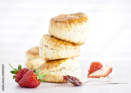 Cream Tea - scones with jam, cream and strawberrys on a white background