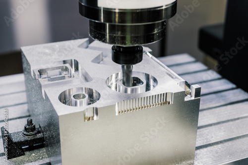 Precision milling CNC machine tool makes part.