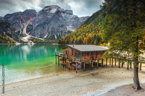 Wonderful wooden boathouse on the alpine lake, Dolomites, Italy, Europe