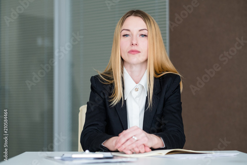 strict and serious company manager. confident business lady in office workspace