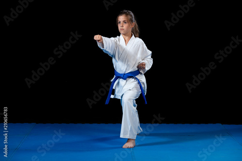 young girl in a white kimono, karate