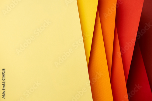 Pattern of overlapping paper sheets in red and yellow tones