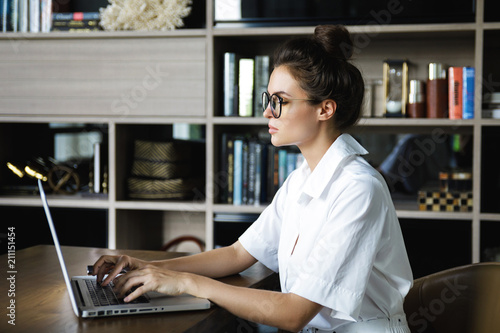 Woman working with laptop in her office