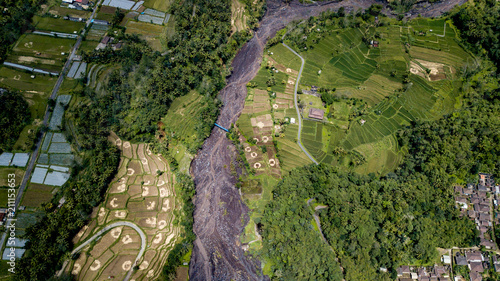 Mount Agung lahar. A lahar is a violent type of mudflow or debris flow composed of a slurry of pyroclastic material, rocky debris and water. The material flew down from mount Agung