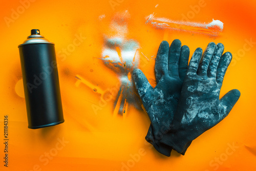 Color spray can and gloves for graffiti artwork