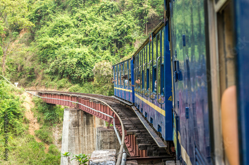 Old steam train ride over a bridge, view from a window, Nilgiri Mountain Railway, Ooty, Tamil Nadu, India