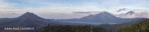 Panoramic view of the mountain of kintamani and two volcanoes, Agung and Batur at dusk on the island of Bali
