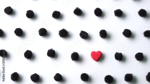 Little red heart in black pom poms polka dot on white background