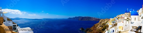 Panorama of Oia. Blue domes and aegean sea.Santorini.Greece