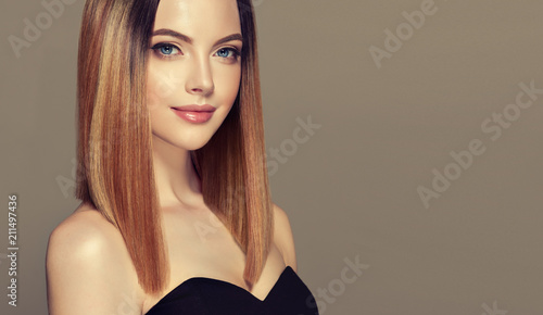 Beautiful model girl with shiny brown and straight long hair .Keratin straightening .Treatment, care and spa procedures.Medium length hairstyle. Coloring, ombre,and highlighting