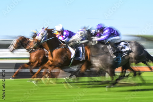 Motion blurred horse racing group image