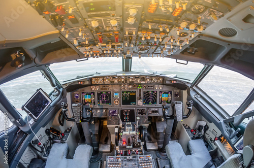 Passenger aircraft interior, engine power control and other aircraft control unit in the cockpit of modern civil passenger airplane.