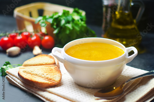 Homemade chicken bouillon or broth. healthy breakfast. black concrete background. selective focus.