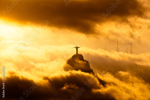Corcovado Mountain with Christ the Redeemer Statue in Clouds on Sunset in Rio de Janeiro, Brazil