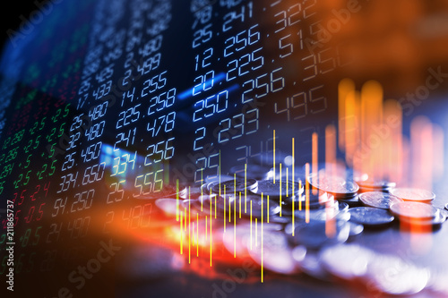 double exposure image of stock market investment graph and coins stack.