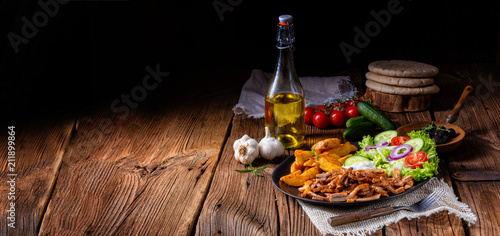 Rustic gyros plate it green salad and potato wedges