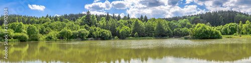 Panorama of lake in the forest or pond in fishing district
