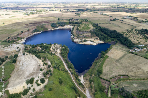 Aerial view of a lake and a river in Pomezia near Rome. Country green and trees. Lake solfatara and Lake posta fibreno