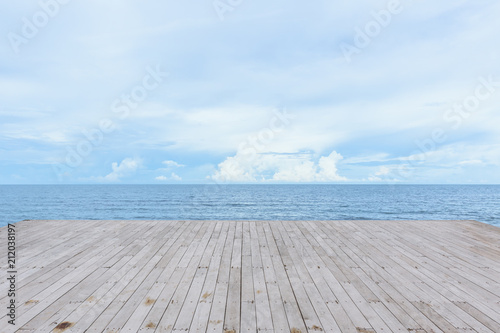 empty wood deck pier with sea ocean view background calm and tranquil