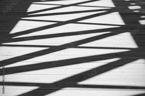 Abstract Shadows of Lines and Figures on a Road as Background or Texture, Black and White Picture