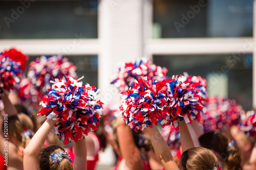 Red, White and Blue Pom Poms, American Cheerleader, Cheerleaders Holding Pom Poms Over Heads, Child Cheerleaders