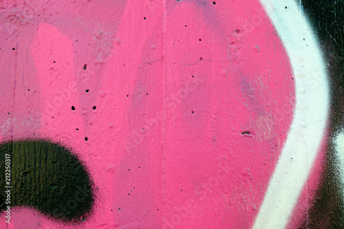graffiti texture on wall in pink, white and black. background