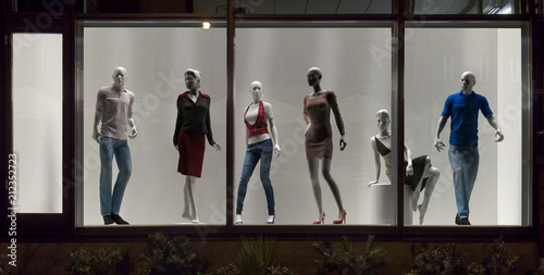 Mannequins in fashion shop, display window, interior design