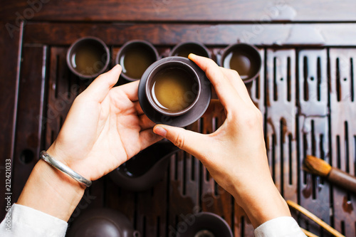 Woman serving Chinese tea in a tea ceremony
