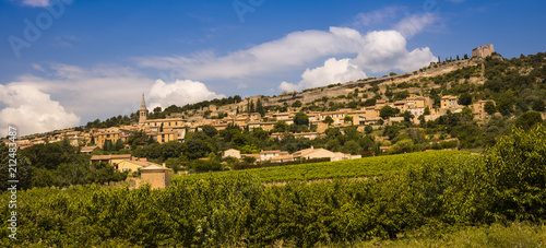 View of Saint-Saturnin-lès-Apt with castle chapel and church. Vaucluse, Provence, France