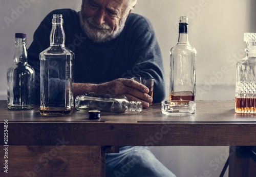 Elderly man drinking alcohol