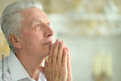 senior man praying