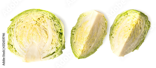 Half a ripe cabbage and two pieces on a white. The view from the top.
