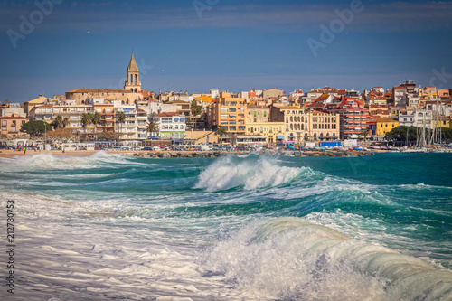 Beautiful Spanish village Palamos in Costa Brava with big waves