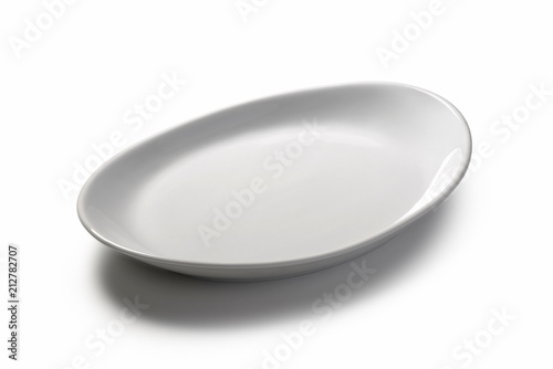 Isolated empty white oval plate