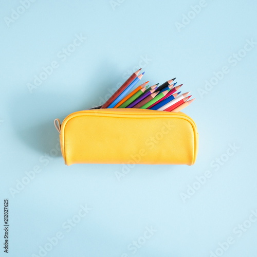 School accessories on soft blue background. Back to school concept. Creativity for kids. Colorful school background. Flat lay, top view, copy space 